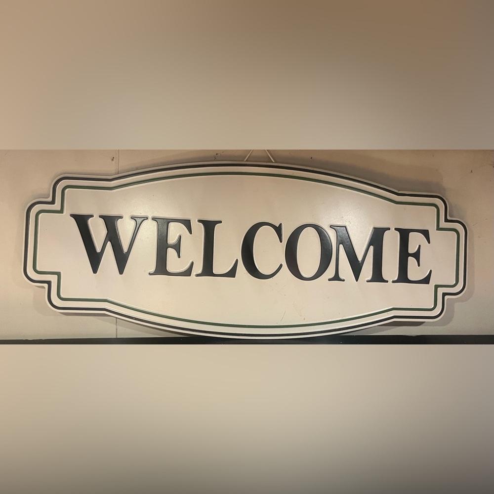Welcome sign 
White black green
Cracker Barrel